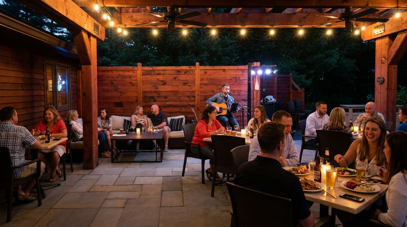 Patio restaurant at dusk with diners seated at candlelit tables under string lights