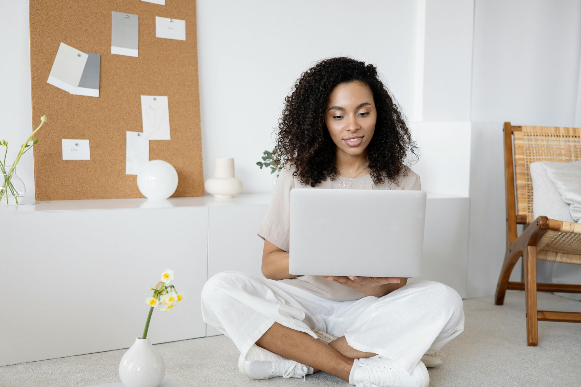 A lady searching the internet for a property management company