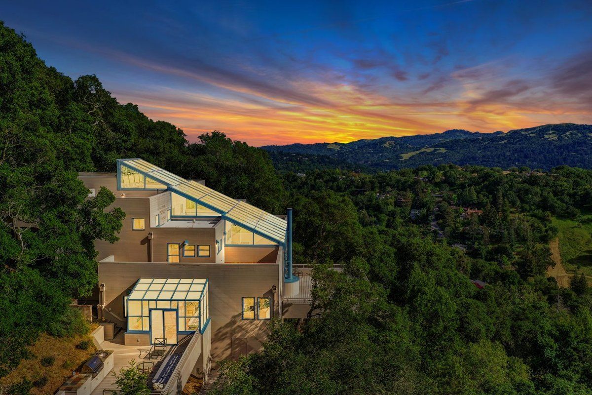 Deck with fire pit, lake view, and modern outdoor seating