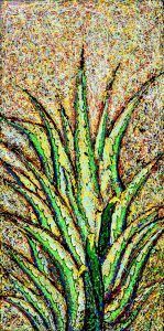 Planta de agave verde y amarillo sobre un fondo bronceado texturizado.