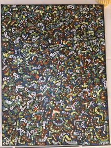 Cuadro abstracto con patrón denso de formas coloridas y amorfas sobre fondo oscuro.