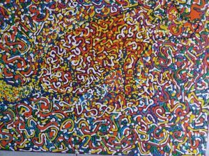 Obra de arte abstracta con líneas y puntos giratorios en colores vibrantes.