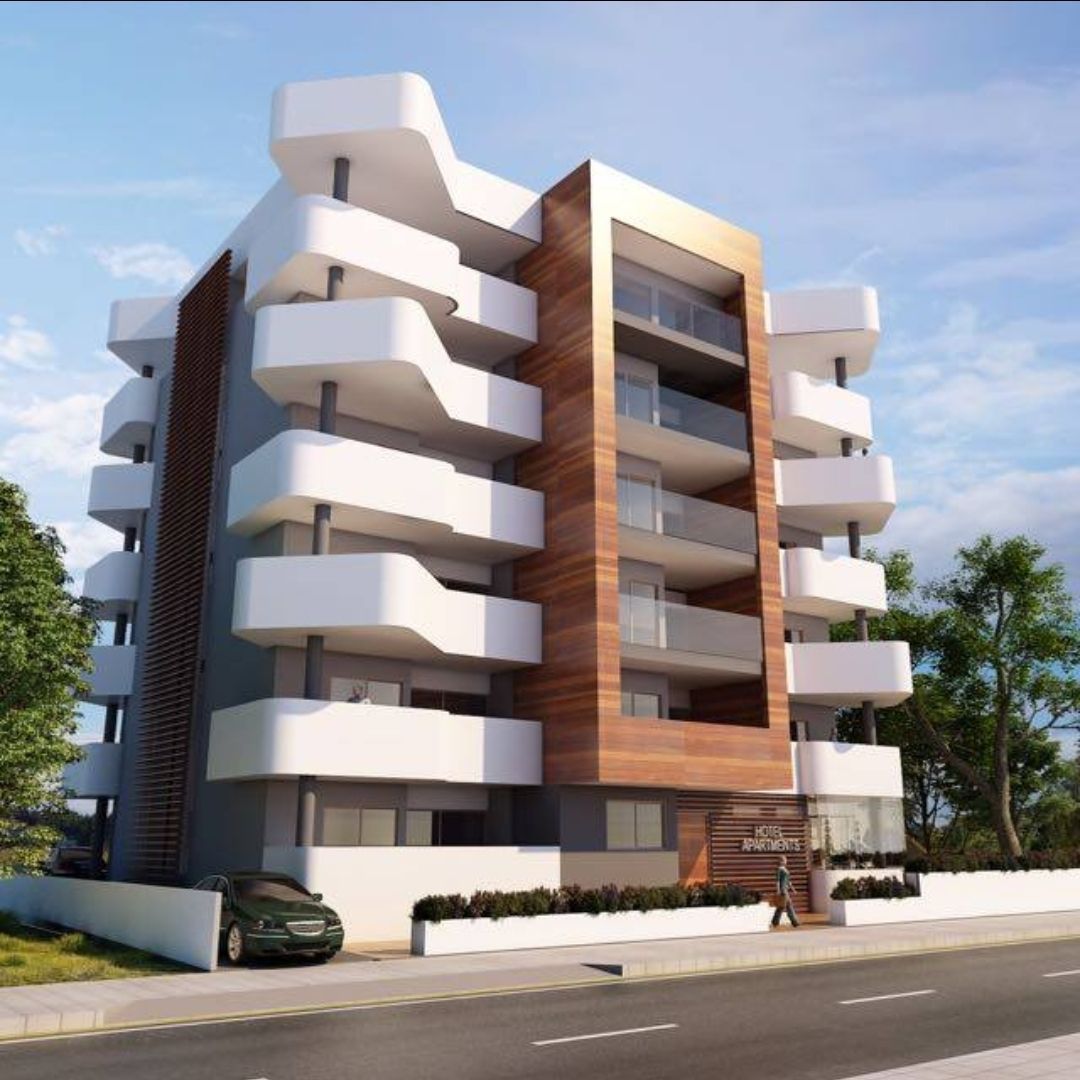 A building with a lot of balconies and a car parked in front of it