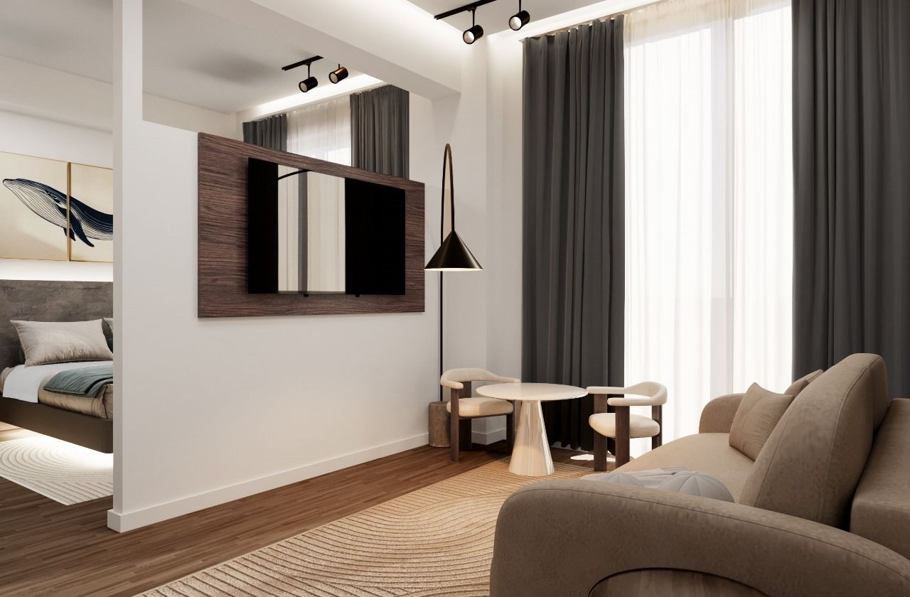 A living room with a couch , chair , table and television.