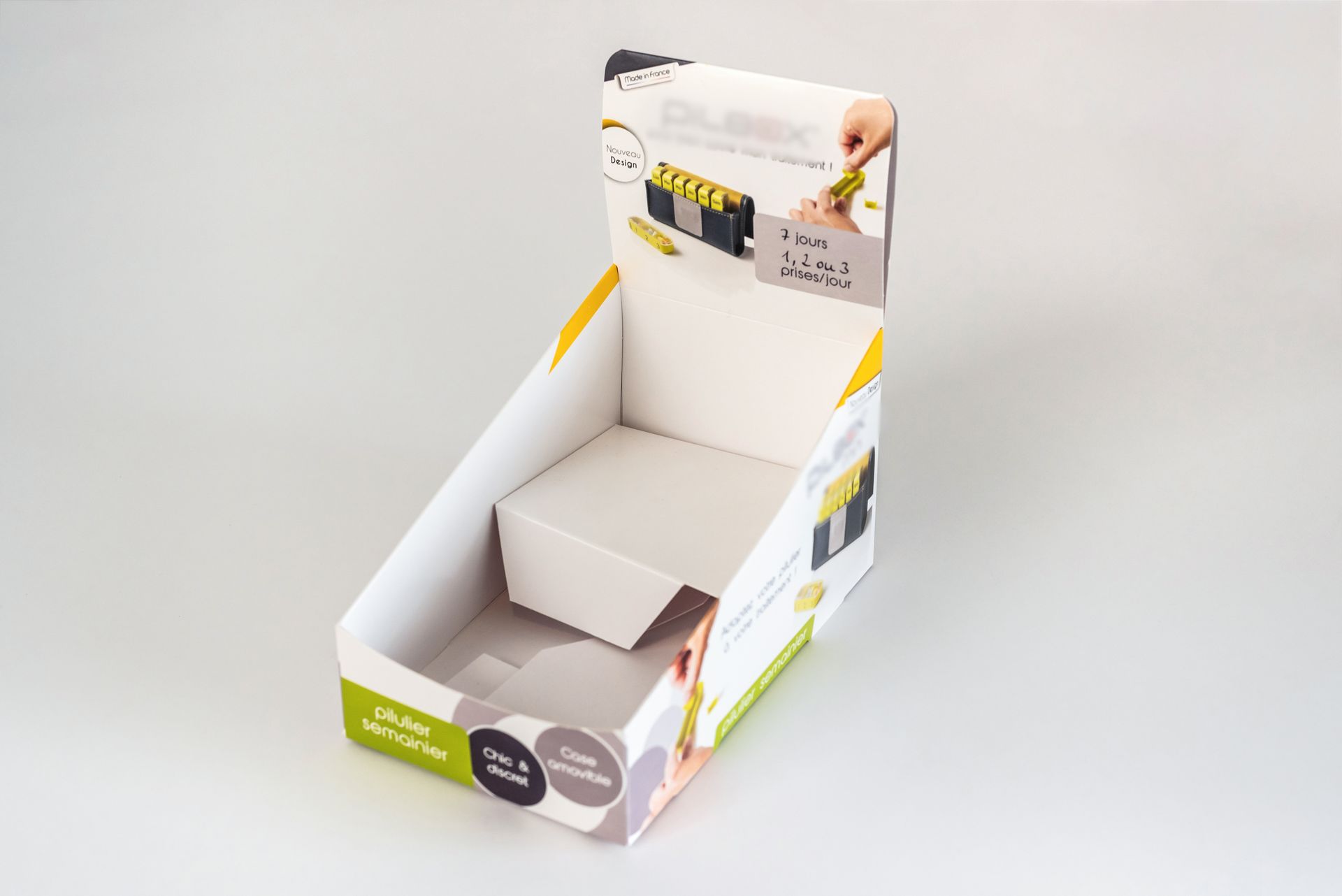 Présentoir en carton pour un pilulier-semainier