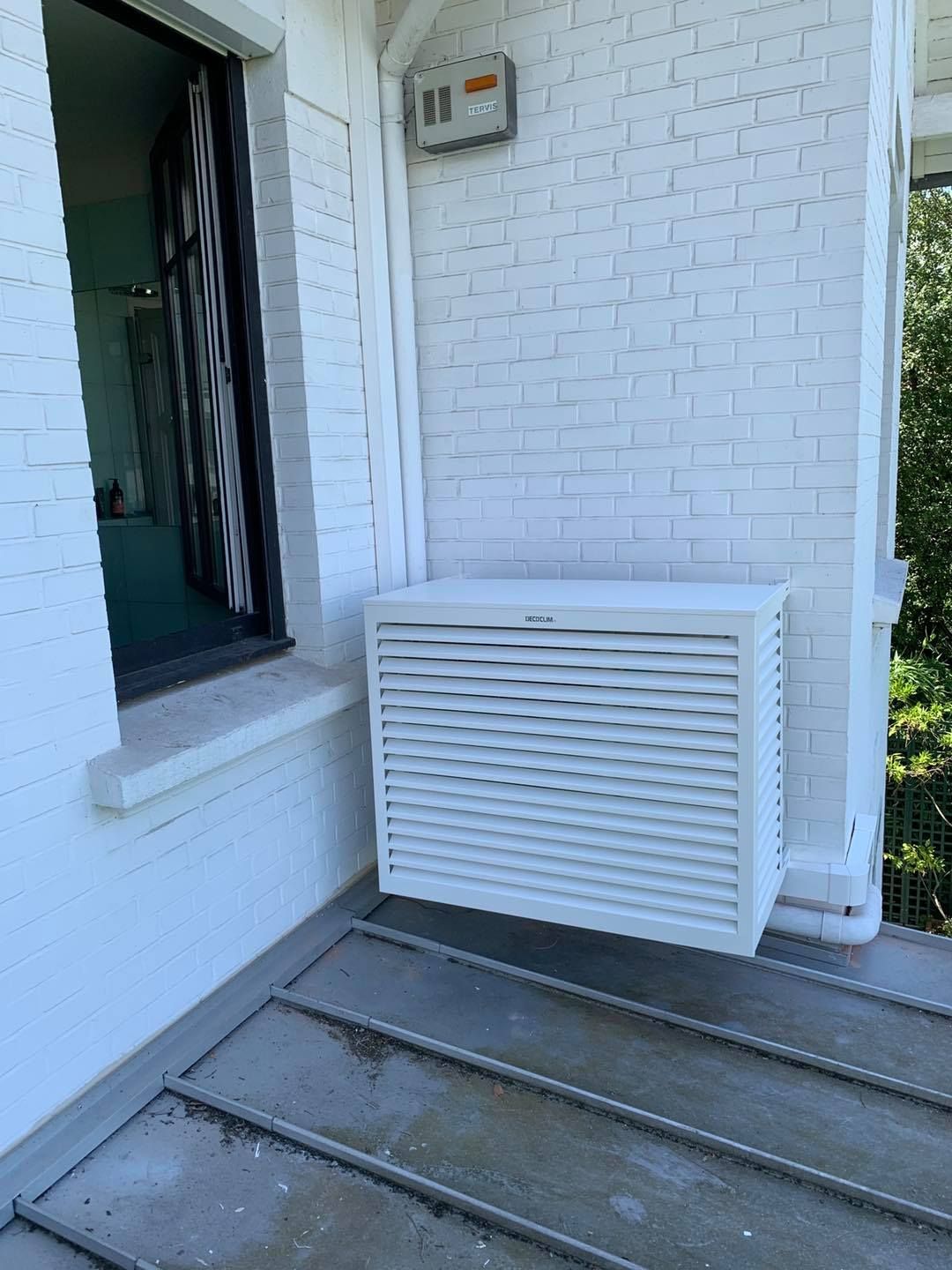 Photographie de PAC en extérieur d'une maison