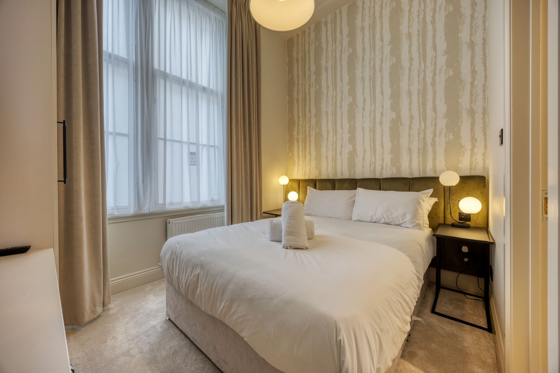 There is a large bed in the middle of the room.