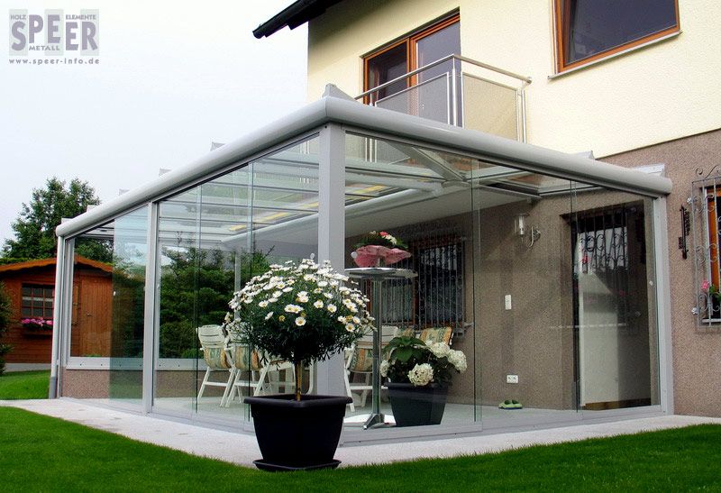 Glashaus mit Ganzglas-Schiebeelemente