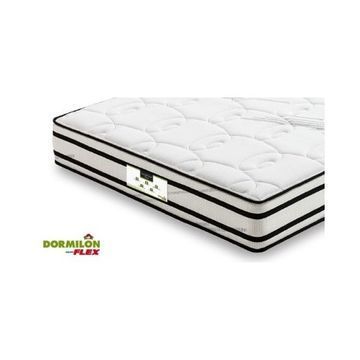 Un colchón blanco con rayas negras está sobre una superficie blanca.