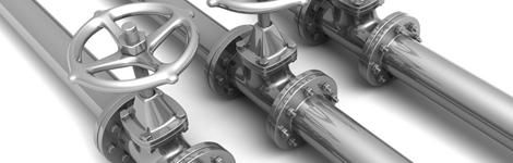 Tres tubos metálicos con válvulas.