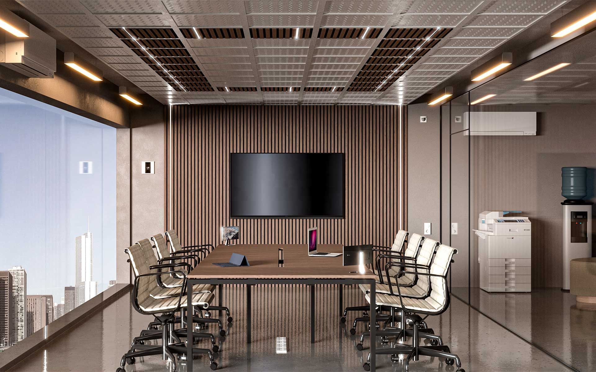 Una sala de conferencias con una mesa y sillas y un televisor de pantalla plana en la pared.