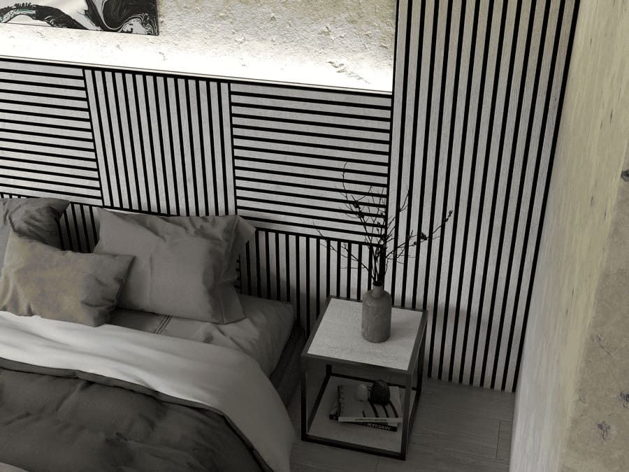 Una fotografía en blanco y negro de un dormitorio con una cama y una mesita de noche.
