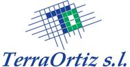 Logotipo de Terra Ortiz sl: Letra "T" geom&eacute;trica azul y verde sobre una cuadr&iacute;cula de l&iacute;neas azules