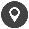 Un icono de pin blanco en un círculo negro sobre un fondo blanco.
