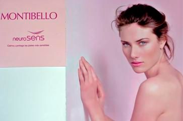 Una mujer sin camisa está parada frente a un cartel que dice montibello neurosens.