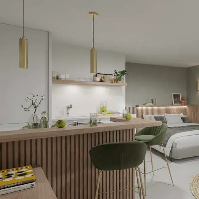 Un dormitorio con una cama, sillas, una cocina y un bar.