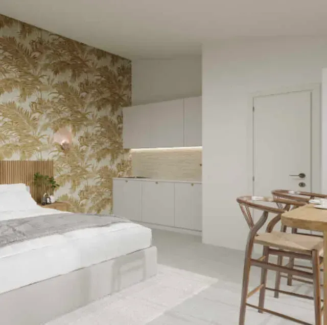 Un dormitorio con una cama y una mesa y sillas.