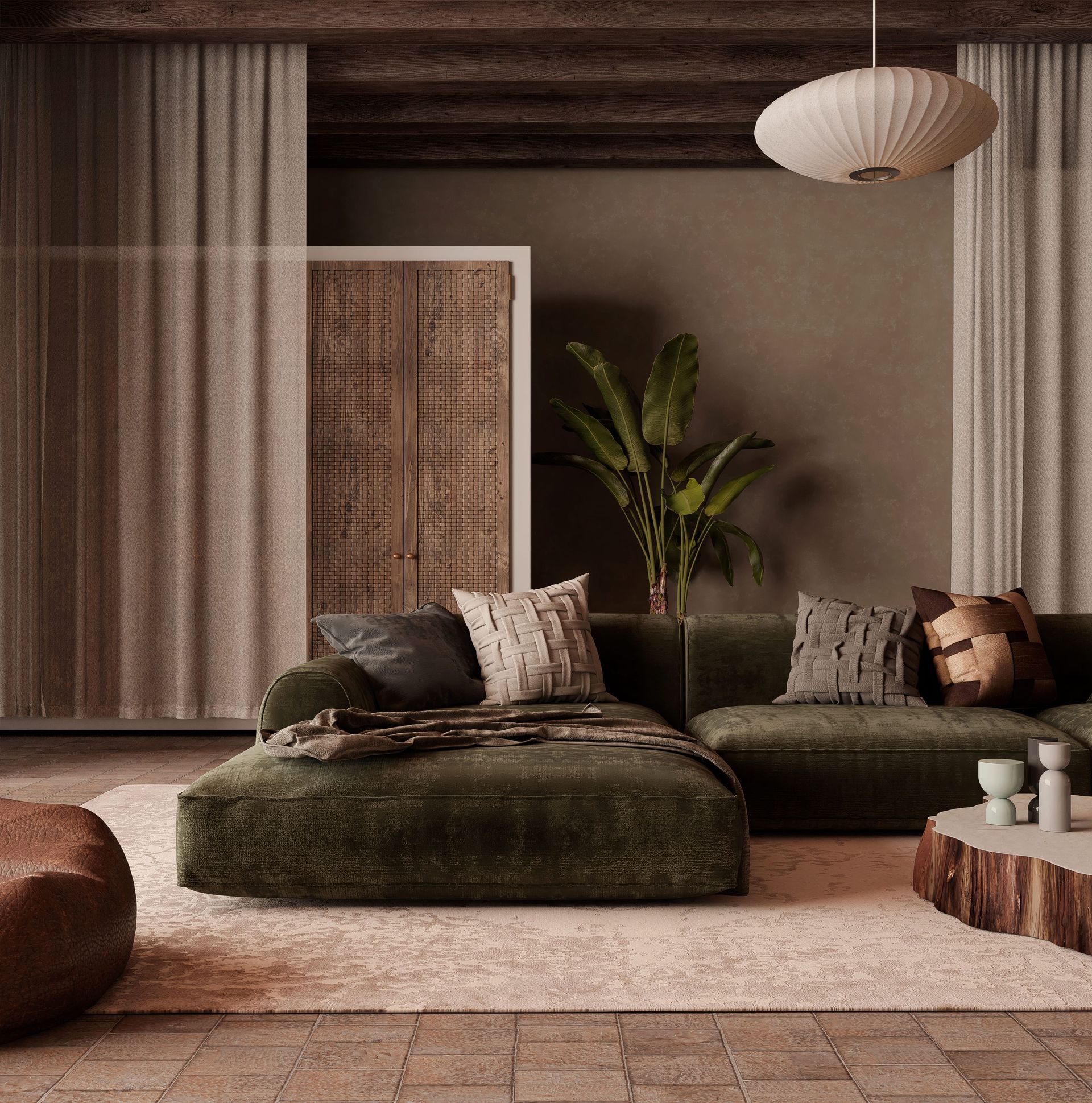 Sala de estar con sofá seccional verde, alfombra, armario de mimbre y cojines decorativos.