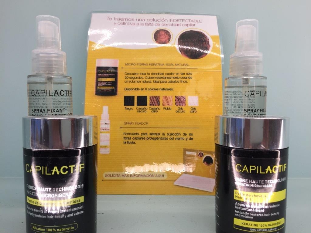 Dos botellas de Capilact están una al lado de la otra.