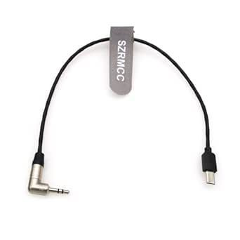 Cable de audio negro con conector en ángulo de 3,5 mm y conector USB-C, unidos mediante una etiqueta.
