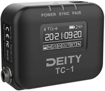 Generador de código de tiempo Black Deity TC-1 con pantalla digital que muestra la hora, la configuración y los indicadores.