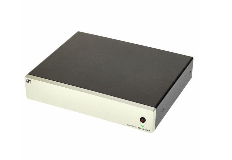 Componente de audio plateado y negro con luz de encendido verde.