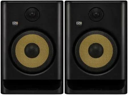 Dos altavoces de monitor de estudio negros con conos amarillos.