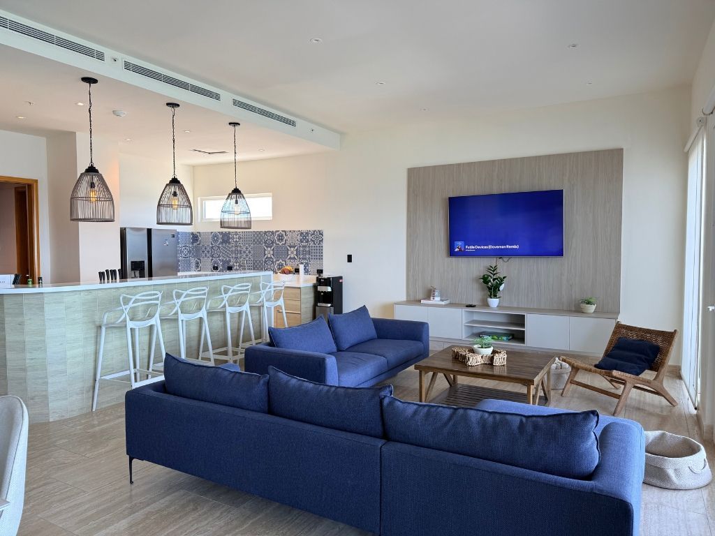 Playa Escondida open-concept living area. Spacious design with ocean breeze, ideal for relaxation or creative work.