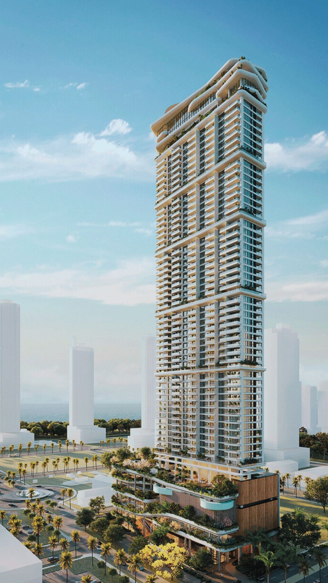 Tall modern skyscraper with tiered balconies, a park, and blue sky.