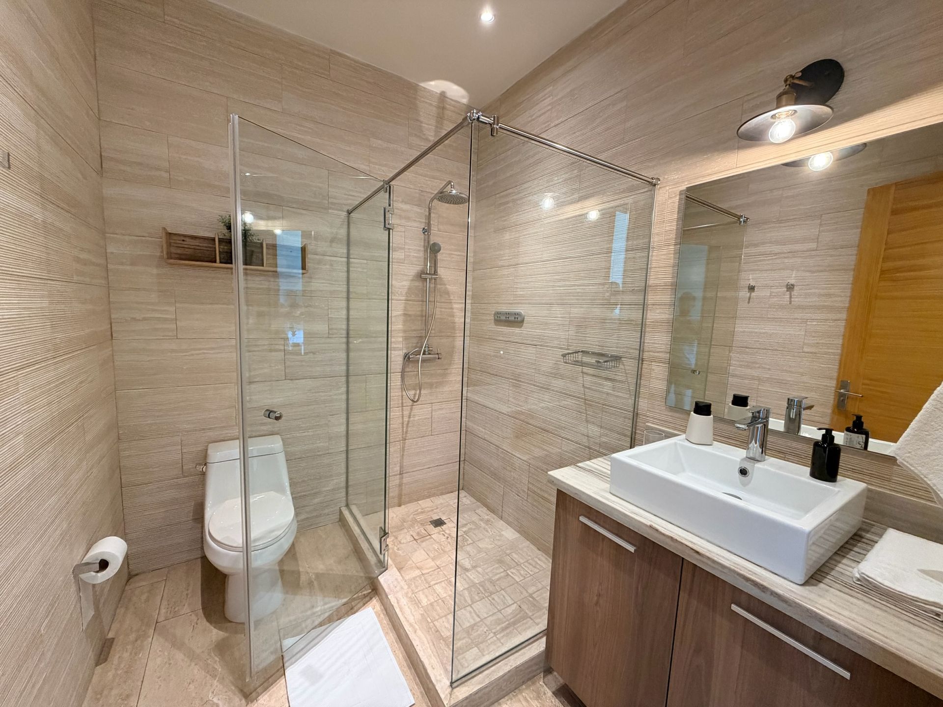 Modern spa-inspired bathroom Playa Escondida. Stone finishes and rain shower for a restorative experience 4