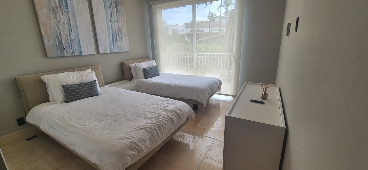 Buenaventura guest suite. Comfortable twin layout in a private estate, perfect for family or team retreats. 2