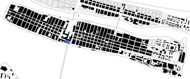 Un mapa en blanco y negro de una ciudad con un círculo azul en el medio.