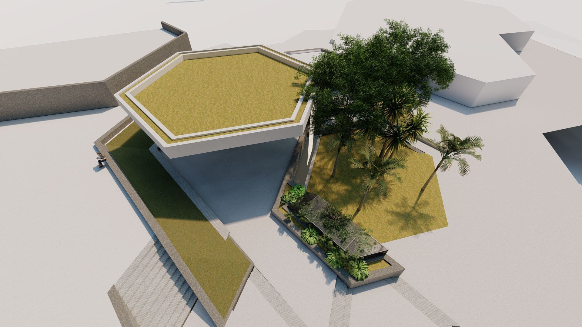 Una vista aérea de un edificio con un árbol en el medio.