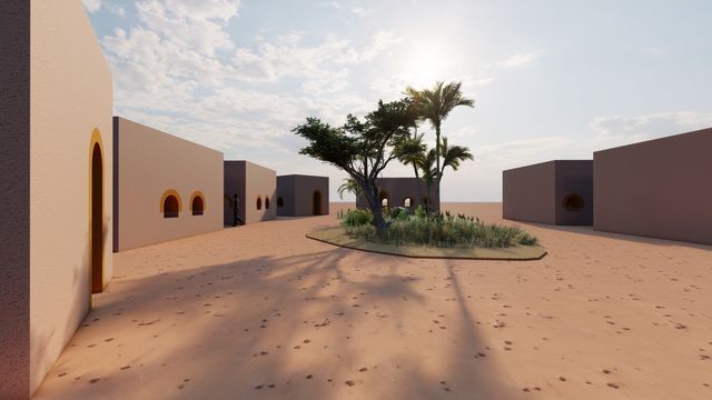 Una hilera de edificios en el desierto con una palmera en el medio.