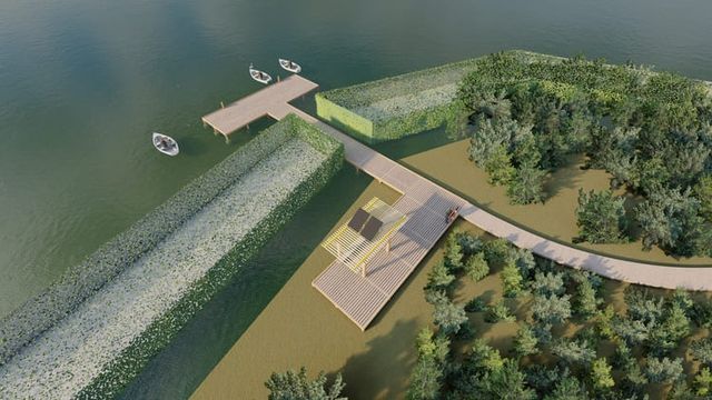 Una vista aérea de un lago con un muelle y barcos.