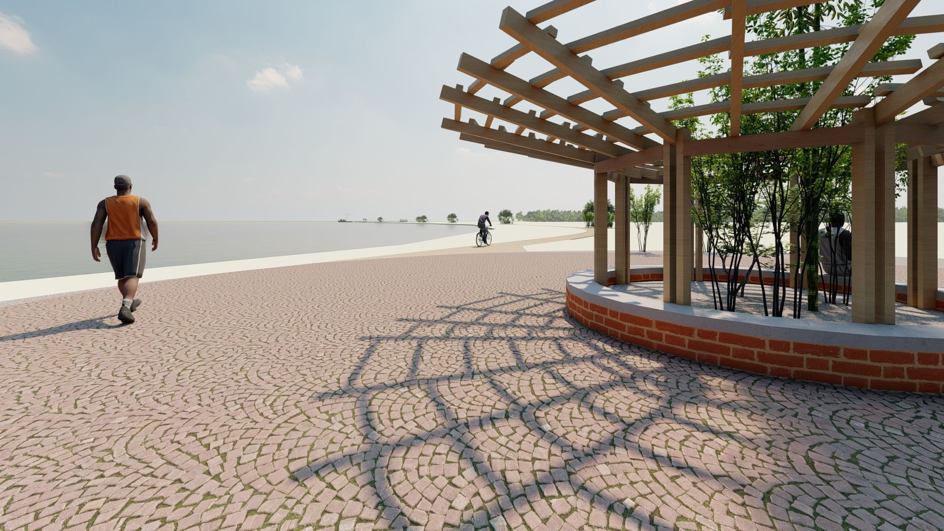 Un hombre camina por un camino adoquinado junto al océano.