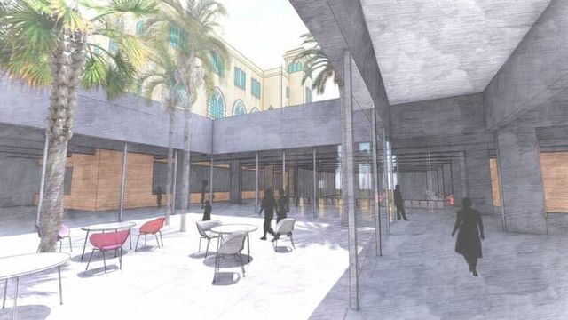 Impresión artística de un patio con mesas y sillas.