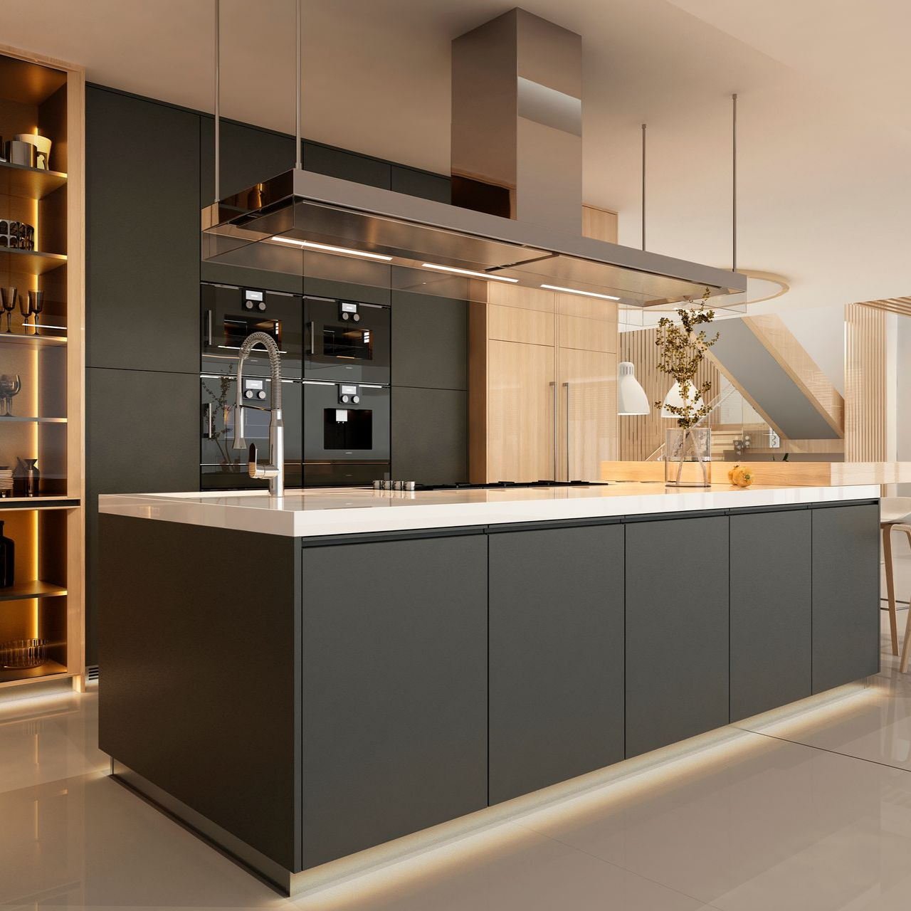 Un îlot de cuisine moderne, avec des armoires gris foncé mat et un comptoir blanc, est installé sous une hotte rectangulaire en métal.