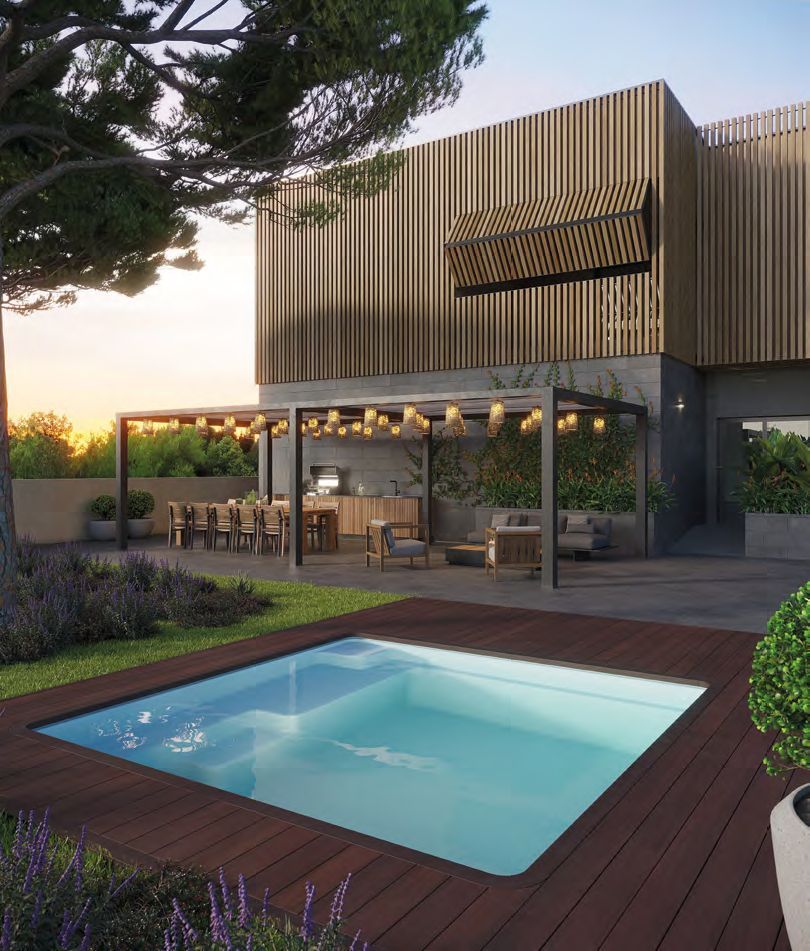 Una grande casa con una piscina di fronte