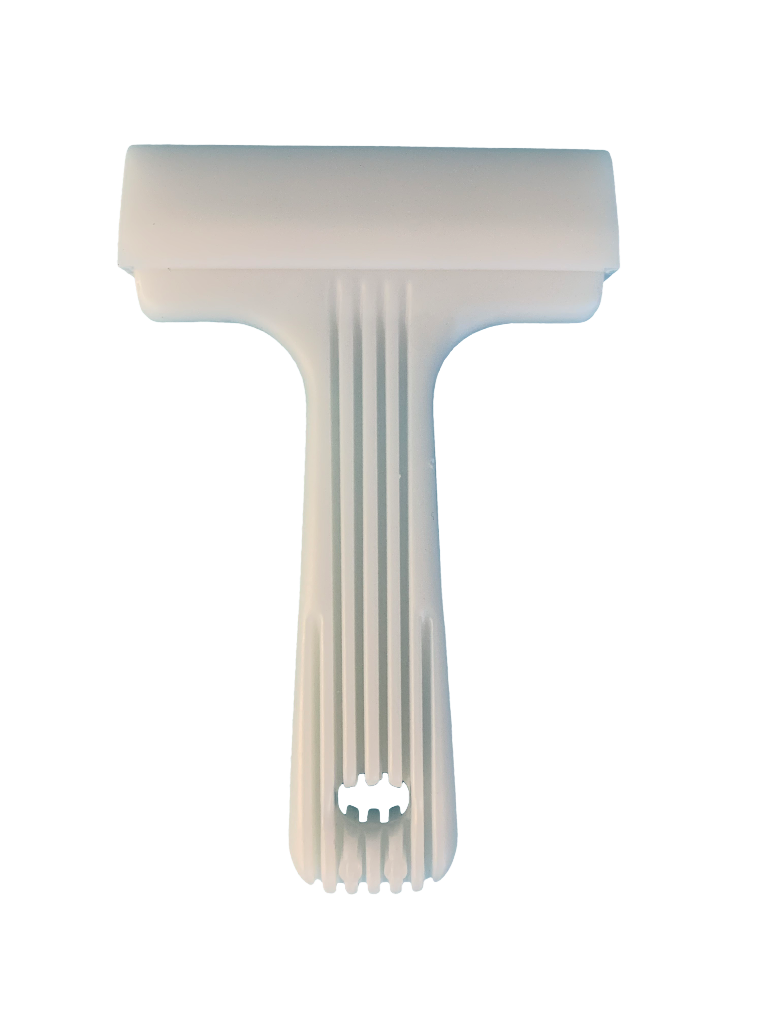 Valkoinen muovinen saumaustela, jossa on uurrettu kahva.