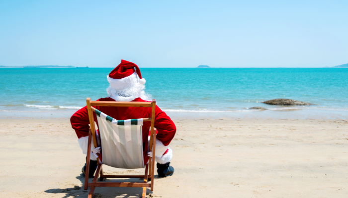 santa sitting on the beach