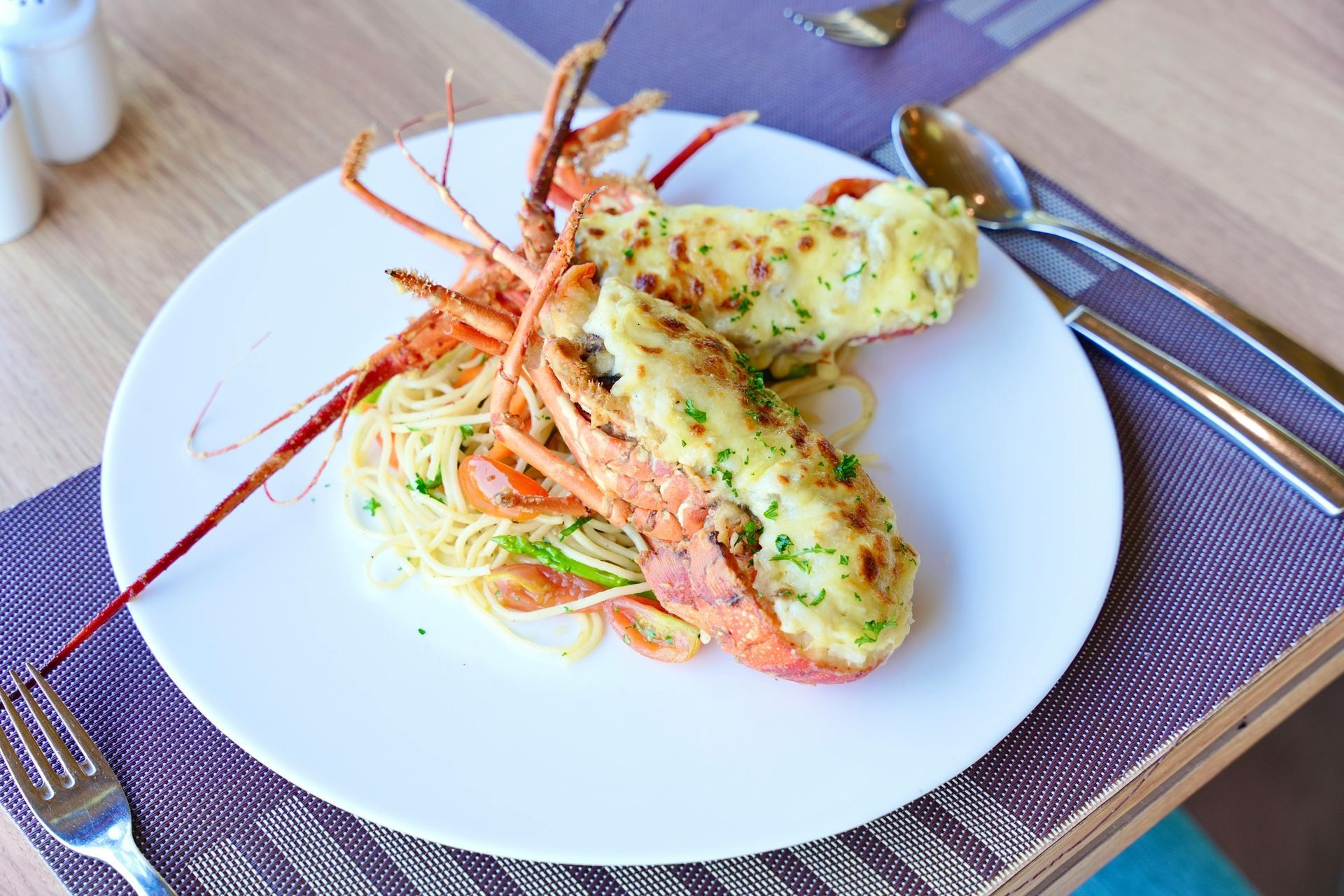 Fishing rods rigged on a boat, blue ocean and sky, sunny day in the florida keys