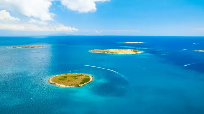 A group of small islands in the middle of the ocean.