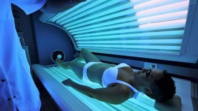 Cabine de bronzage en utilisation