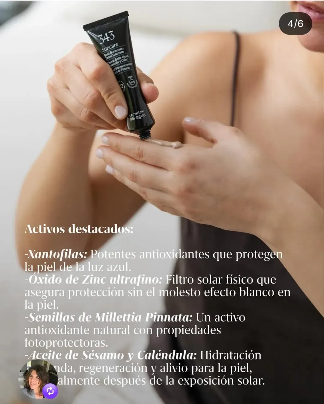 Manos aplicando crema facial oscura de un tubo sobre la piel, con texto promocional en español superpuesto.