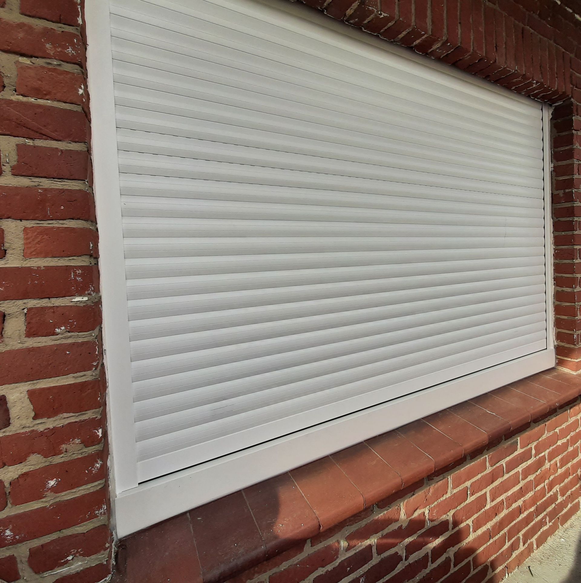 Volet roulant de fenêtre en PVC blanc