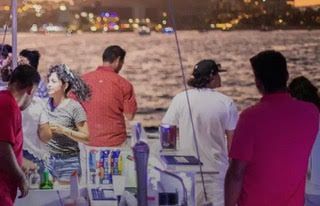 Sunset party cruise on Pez Gato catamaran in Cabo San Lucas