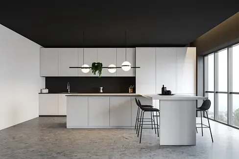 Una cocina moderna con gabinetes blancos y techo negro.