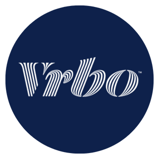 Vrbo logo: white stylized text on a dark blue circular background.