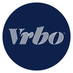 Vrbo logo: white stylized text on a dark blue circular background.